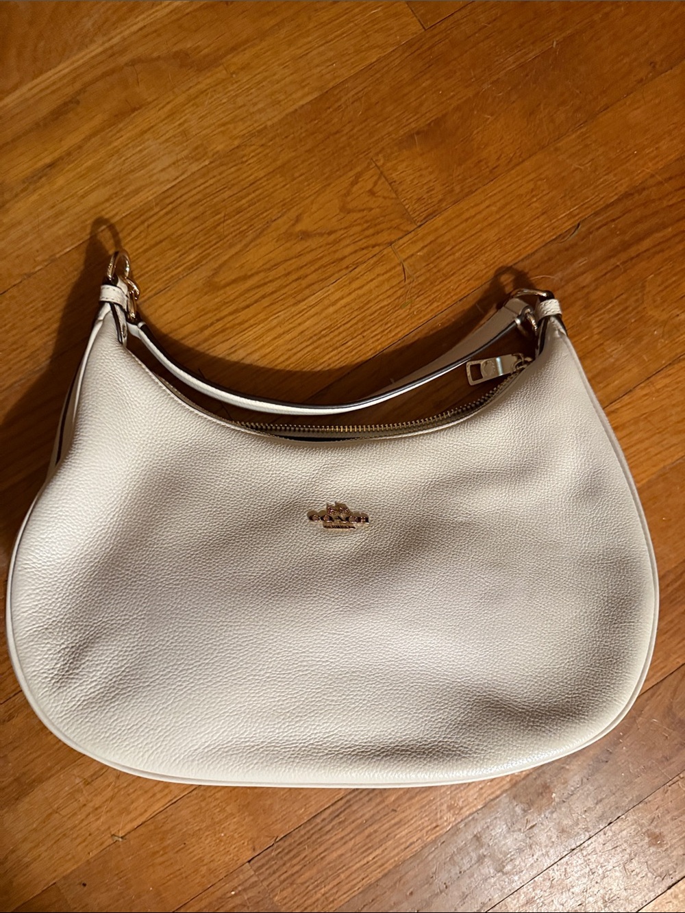 Coach Pebbled Leather Hobo Bag in Cream with Gold Hardware.